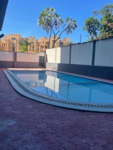 a swimming pool with a ramp in a city at Nyali Vale residence-14 in Mombasa