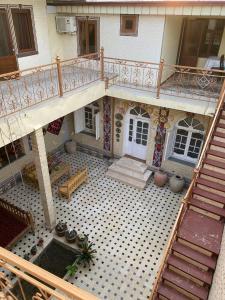 an aerial view of a house with a balcony at Parivash Guest House in Bukhara