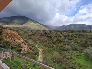 a view of a valley with mountains in the background at Delvilla in Delvinë +4 photos
