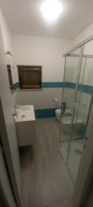 a bathroom with a sink and a toilet at Cala Gavetta 5 in La Maddalena