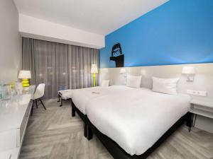 Posteľ alebo postele v izbe v ubytovaní Ibis Styles Wroclaw Centrum