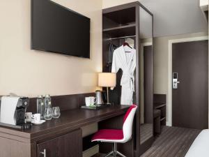 A bed or beds in a room at ibis Styles Sharjah