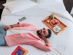 A bed or beds in a room at ibis Styles Sharjah