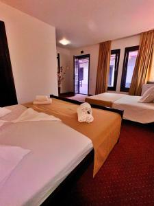 En eller flere senge i et værelse på Complex Tropical