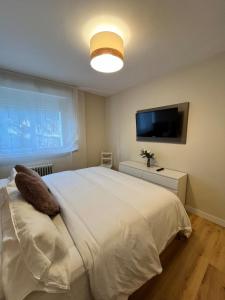 Ένα ή περισσότερα κρεβάτια σε δωμάτιο στο Casa Elso Pamplona