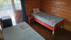 Postel nebo postele na pokoji v ubytování Olga's Home