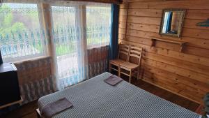 A bed or beds in a room at Olga's Home