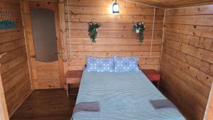 A bed or beds in a room at Olga's Home