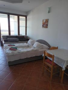 Posteľ alebo postele v izbe v ubytovaní Vuke Apartments + 37 fotografií