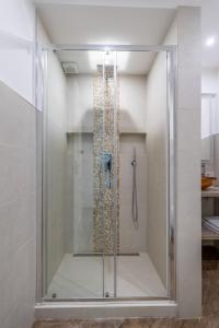 a shower with a glass door in a bathroom at Casa Federica in Ventimiglia