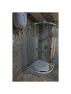 a shower with a glass enclosure in a bathroom at Hotel Shanu Premium in Gulmarg