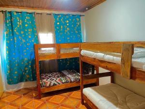 Postel nebo postele na pokoji v ubytování Panyumba Backpackers