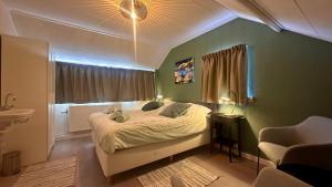 En eller flere senge i et værelse på Strandhuis Everts