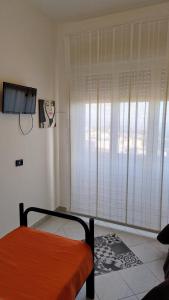 Letto o letti in una camera di Al Dammuso Diffuso in Centro