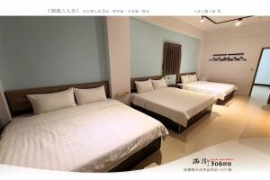 Letto o letti in una camera di 西衛參零陸民宿 Xiwei 306 Inn