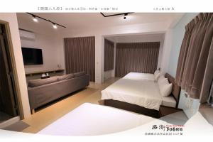 Letto o letti in una camera di 西衛參零陸民宿 Xiwei 306 Inn