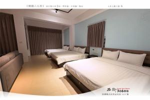 Letto o letti in una camera di 西衛參零陸民宿 Xiwei 306 Inn