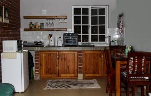 Η κουζίνα ή μικρή κουζίνα στο Firehouse selfcatering Garden Cottage no 2