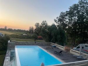 a swimming pool with a van parked next to it at Joli T1 à ne pas manquer in Borgo