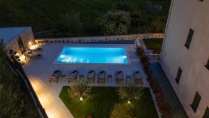 an overhead view of a swimming pool at night at Villa Donatella in Podstrana