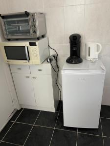 Kuchyň nebo kuchyňský kout v ubytování Grande Chambre meublee