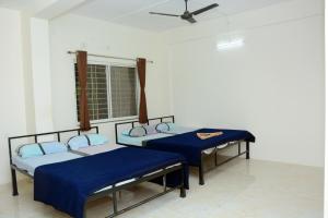 Shree Swami Samarth Resort客房内的一张或多张床位