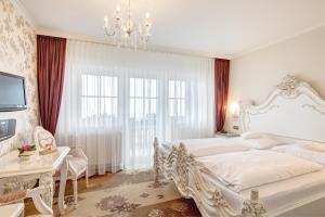 Ein Bett oder Betten in einem Zimmer der Unterkunft Seehotel Hartung & Ferienappartements