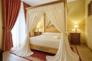 Voodi või voodid majutusasutuse Grand Hotel Vigna Nocelli toas