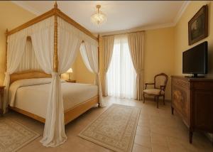 Voodi või voodid majutusasutuse Grand Hotel Vigna Nocelli toas