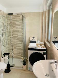 a bathroom with a shower and a toilet and a sink at Vasto Marina Dreamhouse in Vasto +19 photos