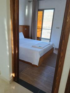 Postel nebo postele na pokoji v ubytování Malak House