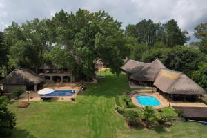 an aerial view of a resort with a swimming pool at Luxury Family Villa On The Vaal River in Sasolburg