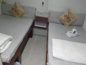 Postel nebo postele na pokoji v ubytování Ranjit Guest House
