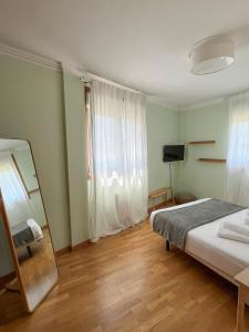 Ένα ή περισσότερα κρεβάτια σε δωμάτιο στο Miño Sweet Home