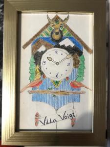 a drawing of a clock in a framed picture at VillaVoigt, een Gezellig Familiehuis in Äussere Kainisch +43 photos