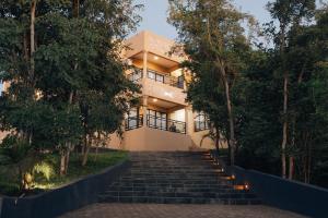 a building with stairs in front of it at The KWASU Apartments in Chipata
