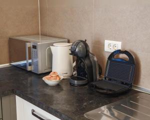 a kitchen counter with a coffee maker and a mixer at Bepo Studio Apartment - FREE PARKING in Split
