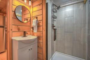 a bathroom with a sink and a shower at Luxury in the Smokey Mountains Pet Friendly with Hot Tub in Elizabethton +76 photos
