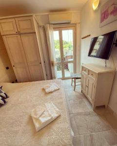 TV/trung tâm giải trí tại Casa Nina La Maddalena