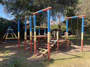 a park with a playground with a swing set at Elqui Antu in Vicuña +2 photos