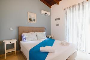 Posteľ alebo postele v izbe v ubytovaní Cathrin Beachfront Villa
