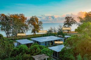 an aerial view of a house in the trees at Katsetiu Villas in Kampong Telaga Papan