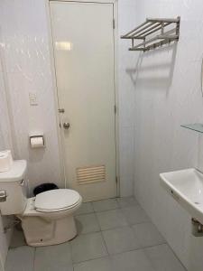 a bathroom with a toilet and a sink at S & E homes 2 in Babuy +17 photos
