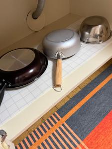 a counter top with a pot and pans on it at inn 2nd 102 in Kurashiki +21 photos