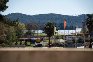 a parking lot with cars parked in a parking lot at Apartments Ivo Bozinovic in Tivat