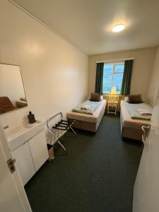 Voodi või voodid majutusasutuse Arsalir Guesthouse Vik B&B toas