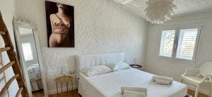 A bed or beds in a room at Boutique Art Villa Maria