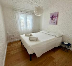 A bed or beds in a room at Boutique Art Villa Maria