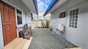 a hallway of a building with two air conditioners at Rawai Naiharn 3 bedroom house in Rawai Beach