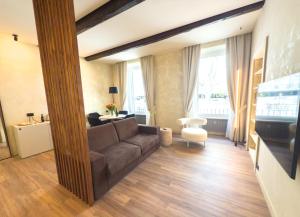 a living room with a couch and a table at Pantheon Urbes Collection in Rome